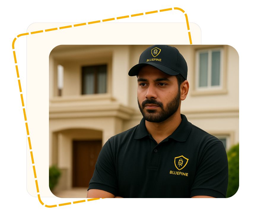 South Asian BluePine security guard standing outside a residential villa, providing professional protection services